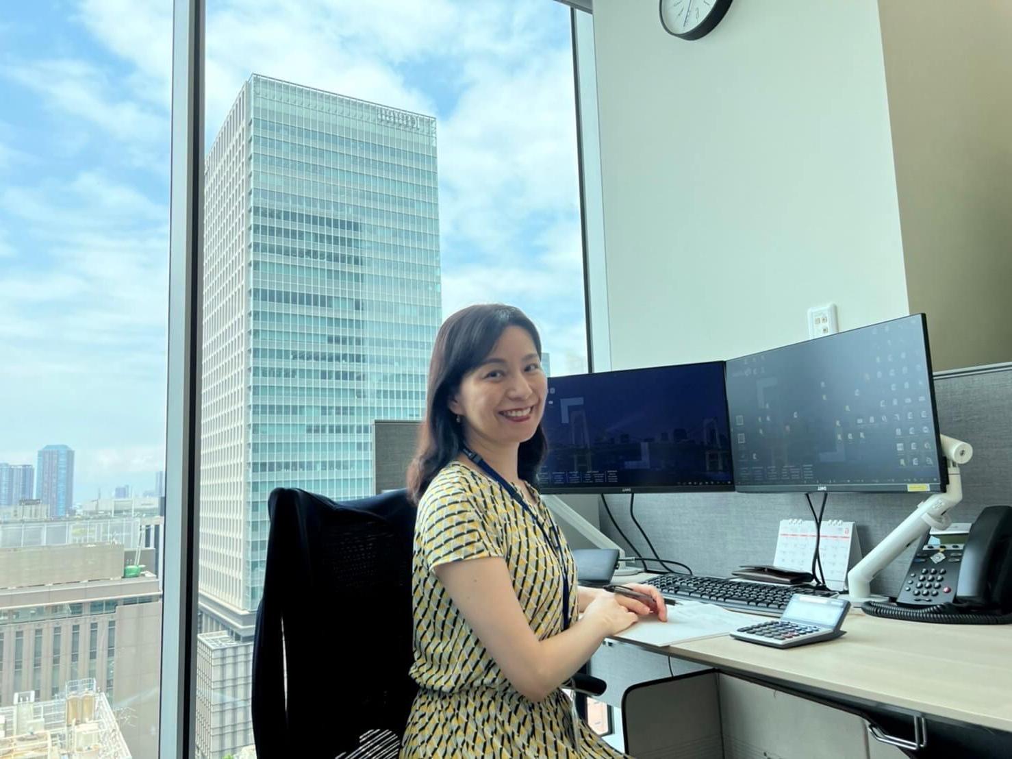 Izumi Watanabe sitting at the desk