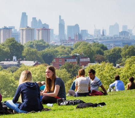 Young people sitting on the hill