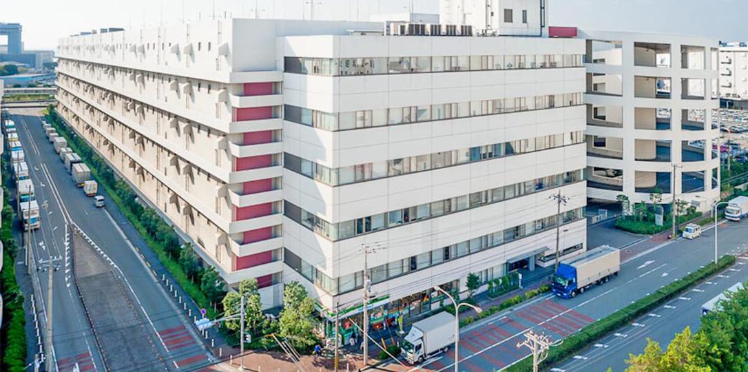 A white building on the corner of the street